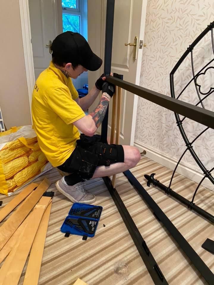 Craig Atkinson Removals team member assembling a bed frame during a house move in Burnley