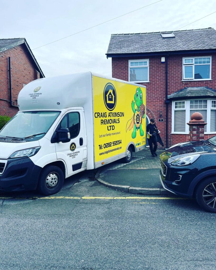 Craig Atkinson Removals van outside a residential property during a local house move in Stockport