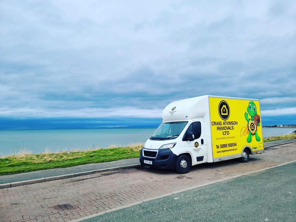 Craig Atkinson Removals van parked by the coast during a long-distance house move to Scotland