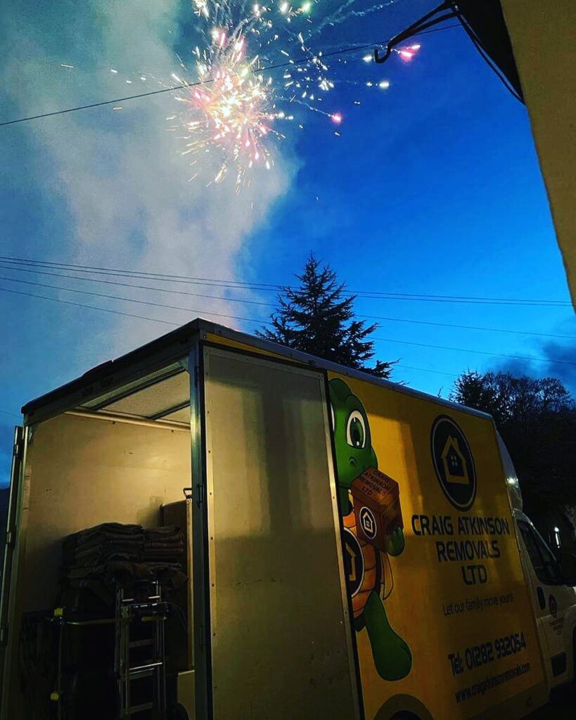 Craig Atkinson Removals van with fireworks in the sky celebrating the New Year.