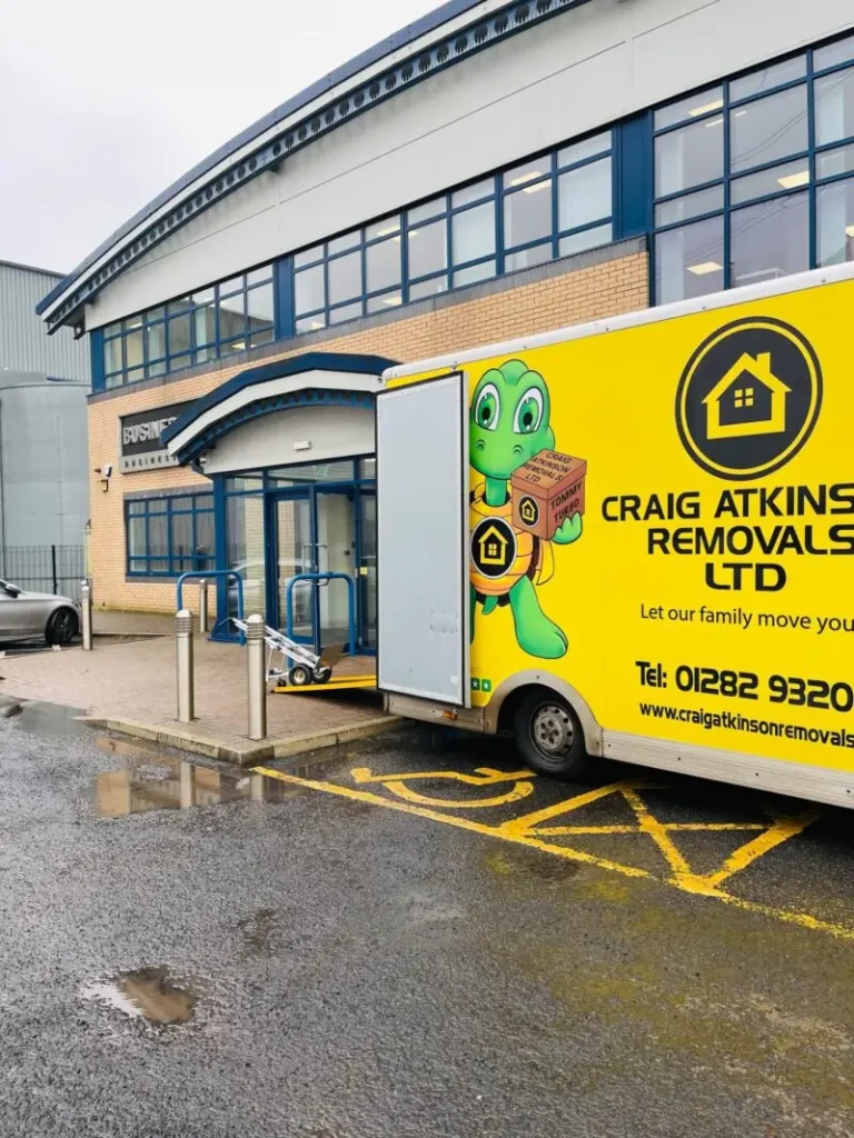 Craig Atkinson Removals van parked outside a business centre in Burnley during a commercial relocation