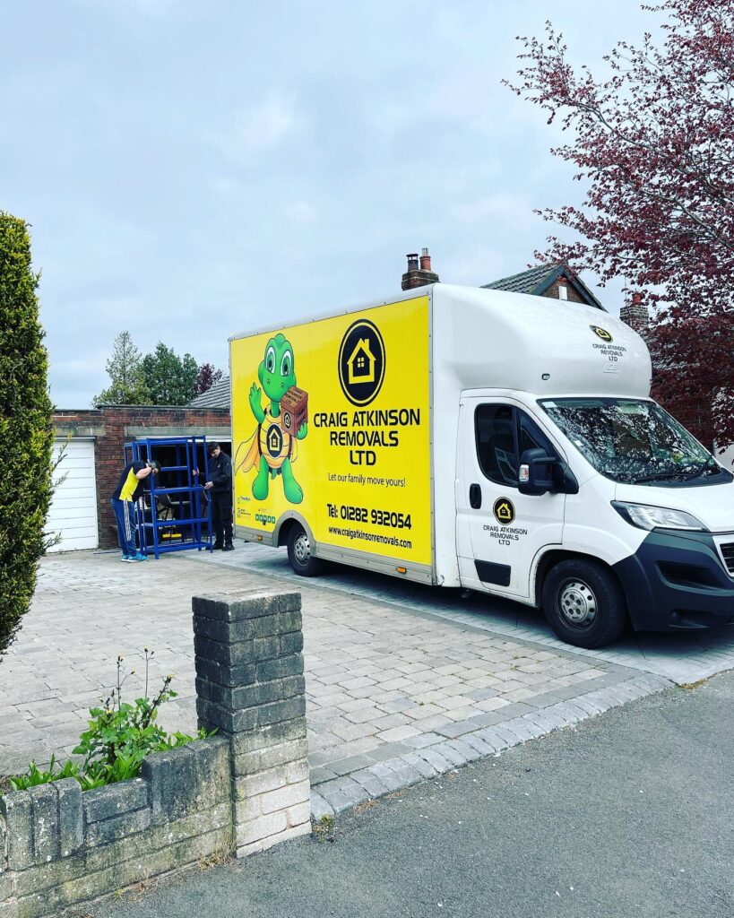 Craig Atkinson Removals van and team carrying out a professional house move in Blackburn, Lancashire.