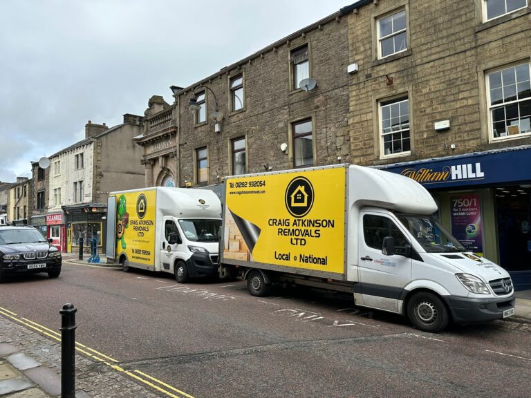 Craig Atkinson Removals vans parked on Albert Road in Colne during a local house and business move.