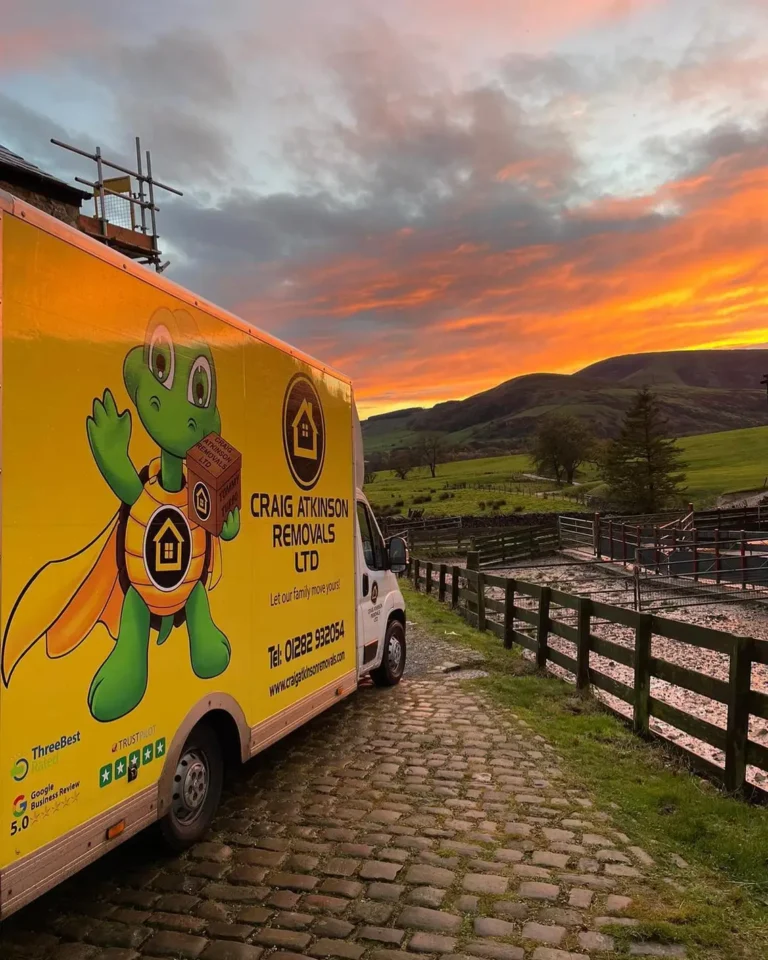 Craig Atkinson Removals van parked on a cobbled countryside lane at sunset during a long-distance house move across the UK.