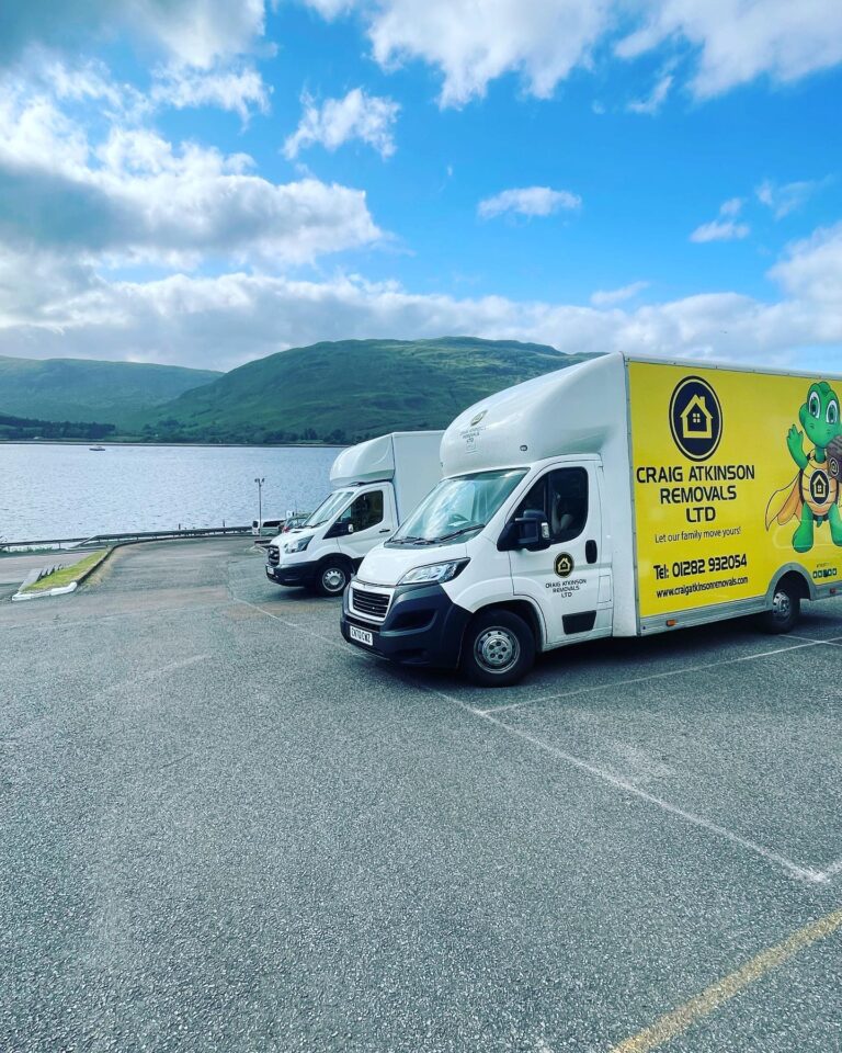 Craig Atkinson Removals vans parked by the water in Fort William, Scotland during a long-distance house move