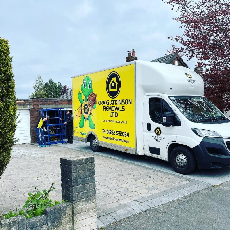 Craig Atkinson Removals van and team carrying out a professional house move in Blackburn, Lancashire.