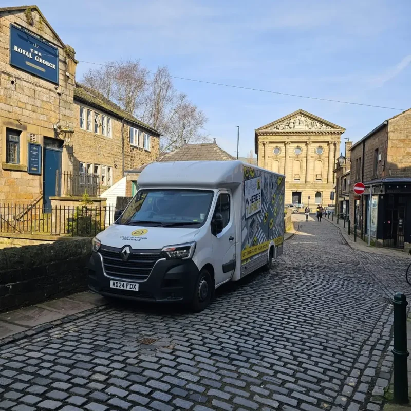 Craig Atkinson Removals van parked on York Street in Clitheroe near The Royal George pub and United Reformed Church.